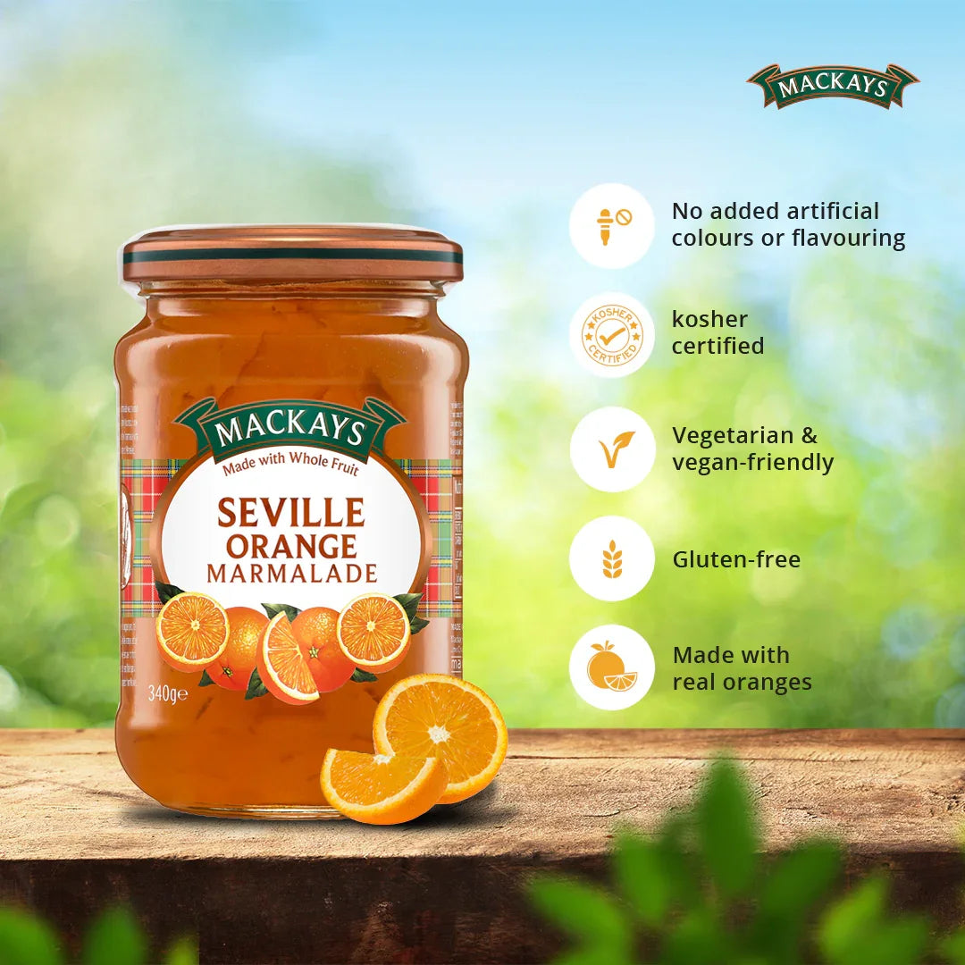 Mackays Seville Orange Marmalade jar on wooden surface with fresh orange slices and product benefits