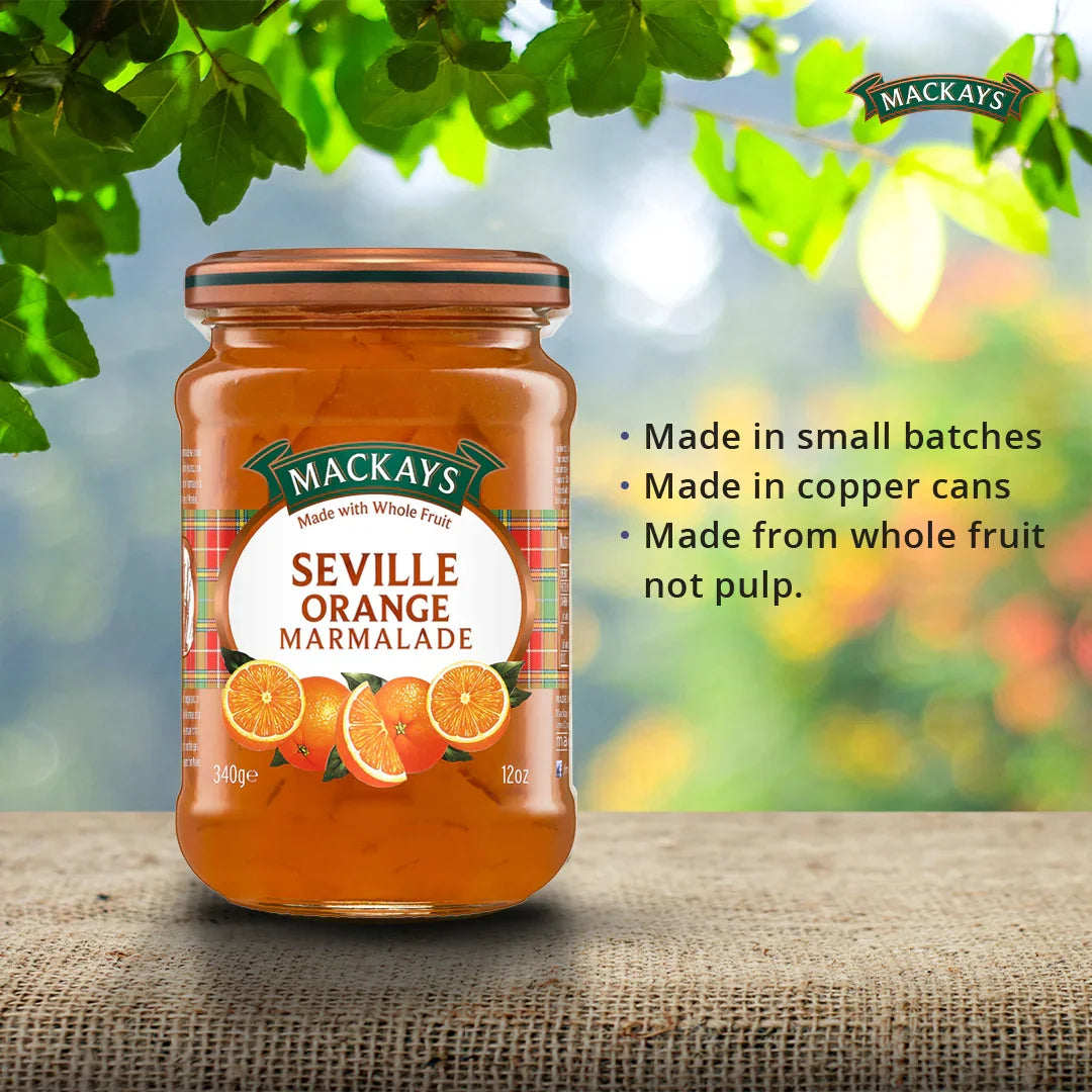 Mackays Seville Orange Marmalade jar on burlap with green leaves and product benefits text