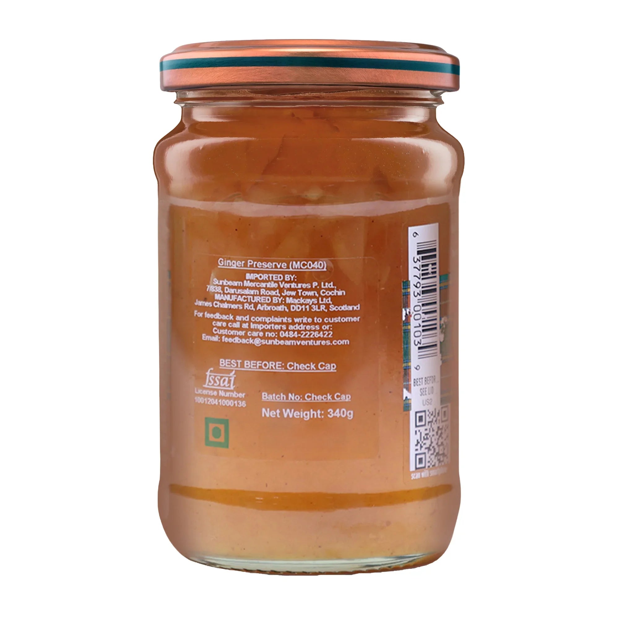 Jar of spiced ginger marmalade with visible ingredients and product label on the back.