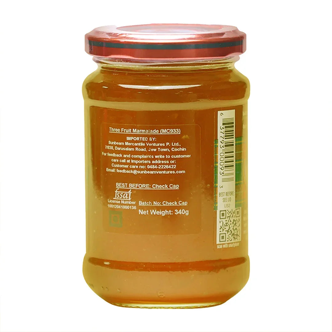 Back view of a glass jar labeled Three Fruit Marmalade, 340g, with nutritional info visible.