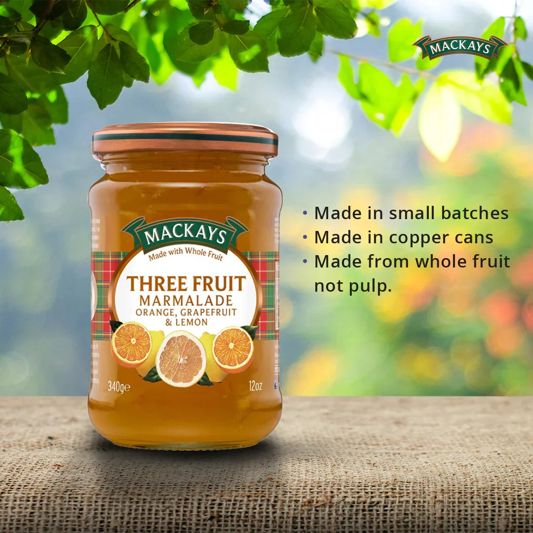 Mackays three fruit marmalade jar on burlap, orange, grapefruit, lemon flavor, natural background