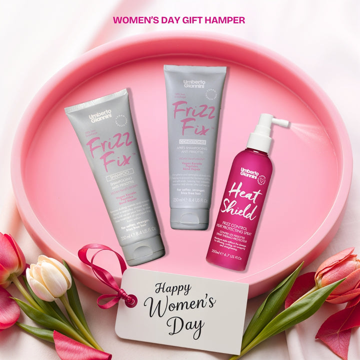 Women’s Day special Hair Care Gift Hamper featuring Umberto Giannini Frizz Fix Shampoo, Conditioner, and Heat Shield Frizz Control Spray, beautifully arranged with a sleek and elegant theme.