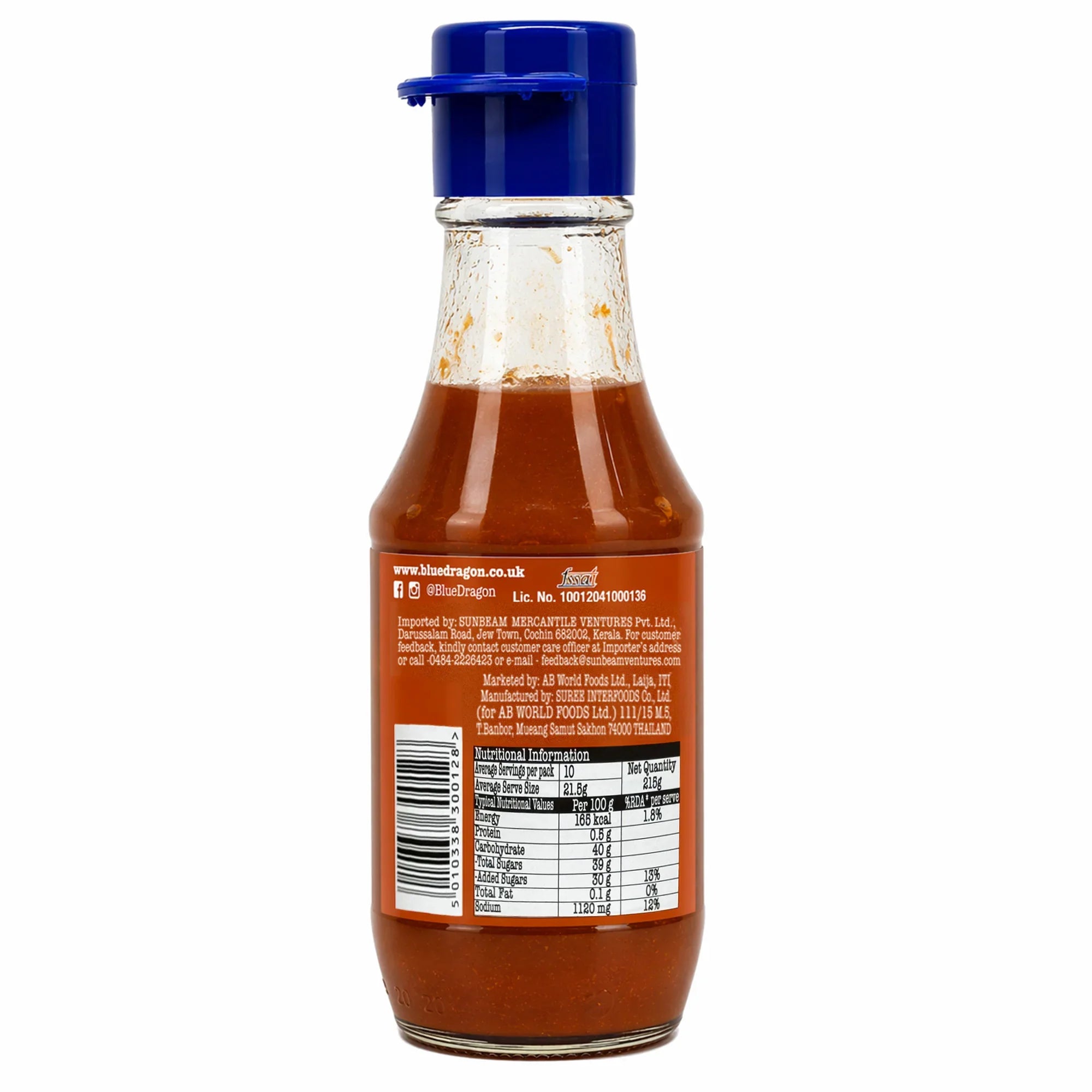 Back view of a mango chili sauce glass bottle with blue cap and nutrition label.