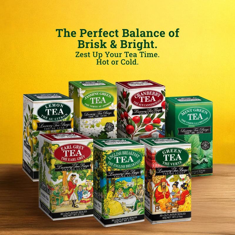 Assorted luxury tea boxes including lemon, jasmine green, cranberry, and mint green tea on a wooden surface with a yellow background.