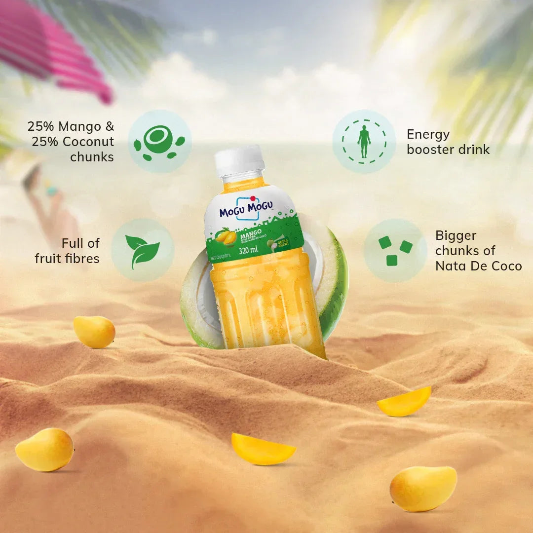 Mango coconut juice bottle with fruit fibers and nata de coco chunks on a sandy beach.