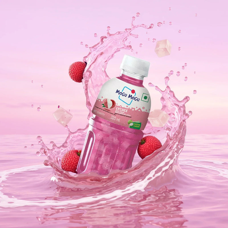 Mogu Mogu lychee juice drink bottle with nata de coco, surrounded by lychees and pink splash