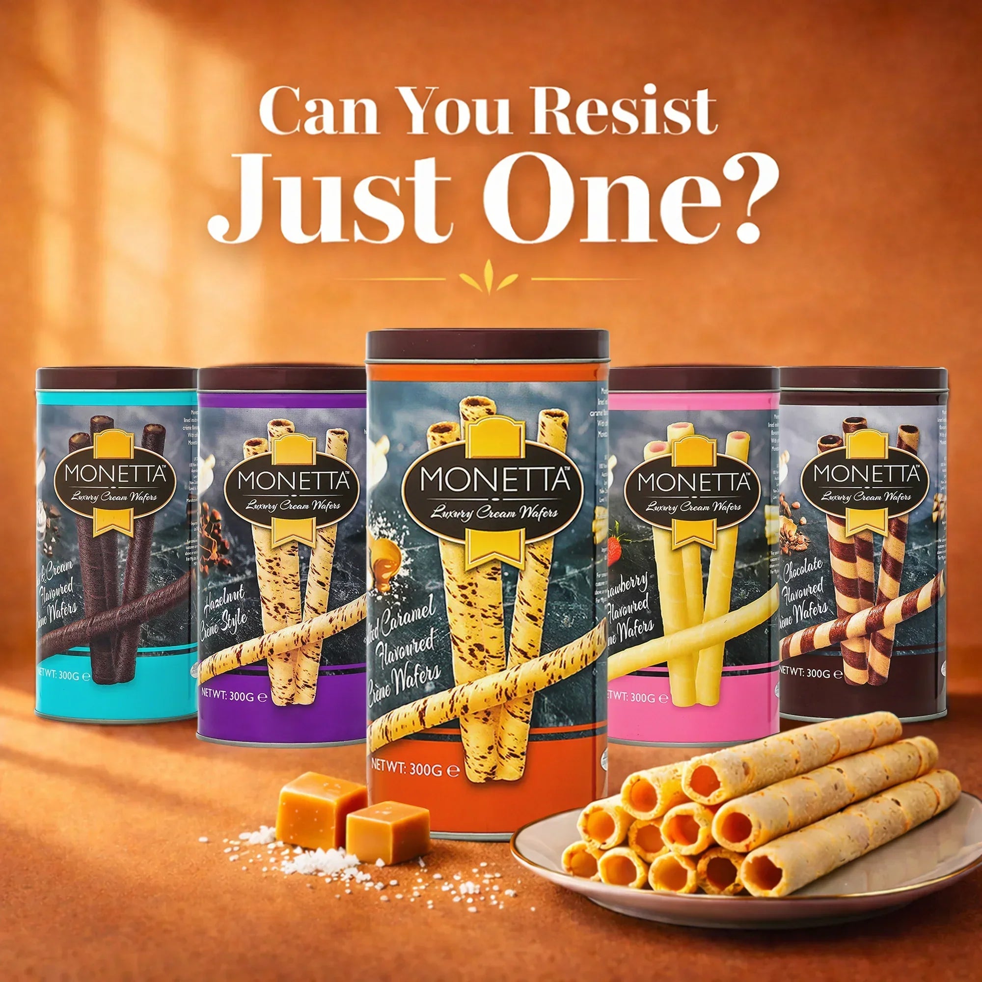 Salted caramel wafer sticks in a tin with plate of rolled wafers and caramel pieces in front