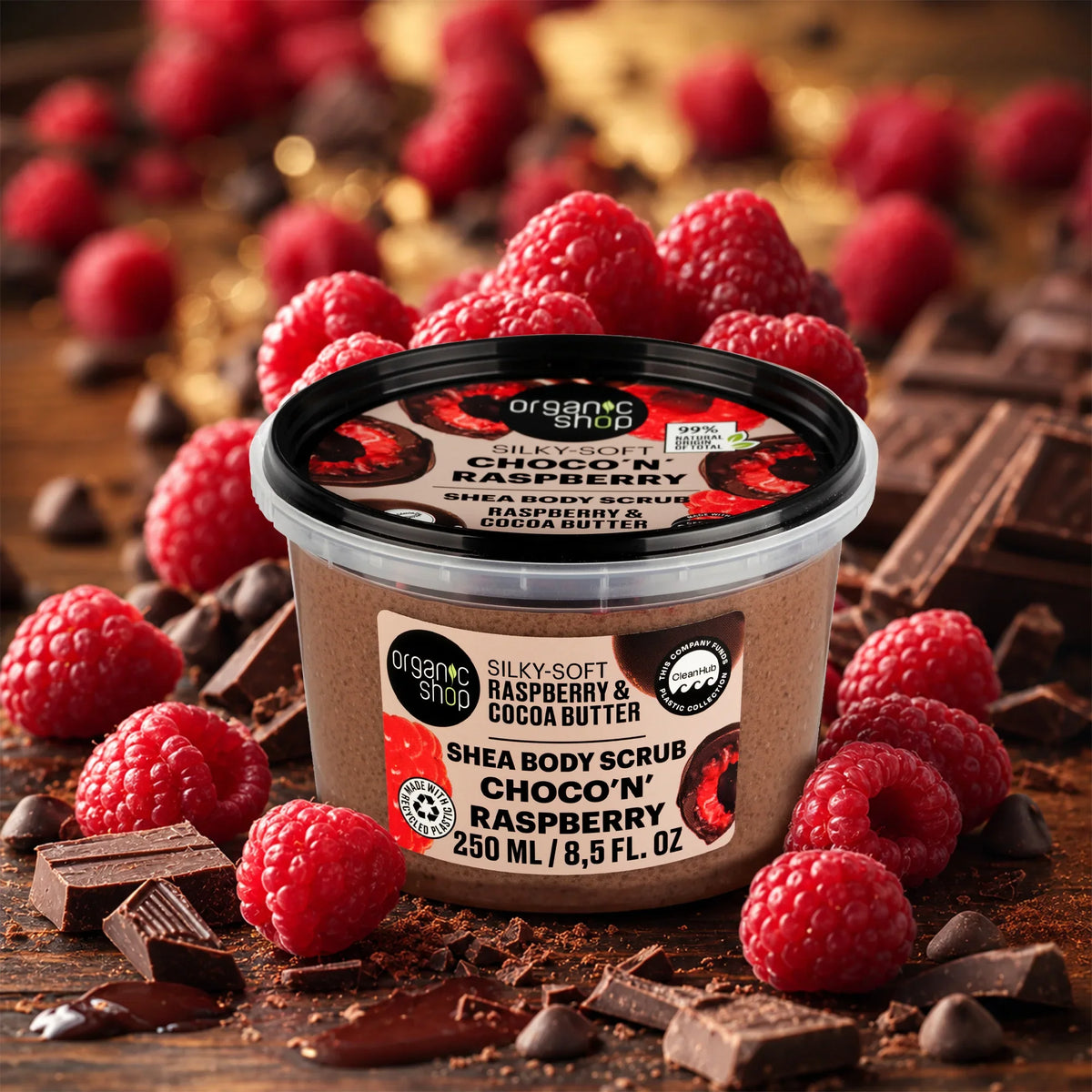 Organic Shop Silky-Soft Raspberry & Cocoa Butter Shea Body Scrub with fresh raspberries and chocolate.