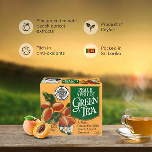 Box of peach apricot green tea with tea cup and apricots on a wooden table, sunset background.