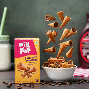 Pik n Pop waffle wonders mini cappuccino cones in a bowl with packaging, milk, and coffee beans