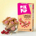 Raspberry mini waffle cones in a glass bowl beside Pik n Pop Waffle Wonders package