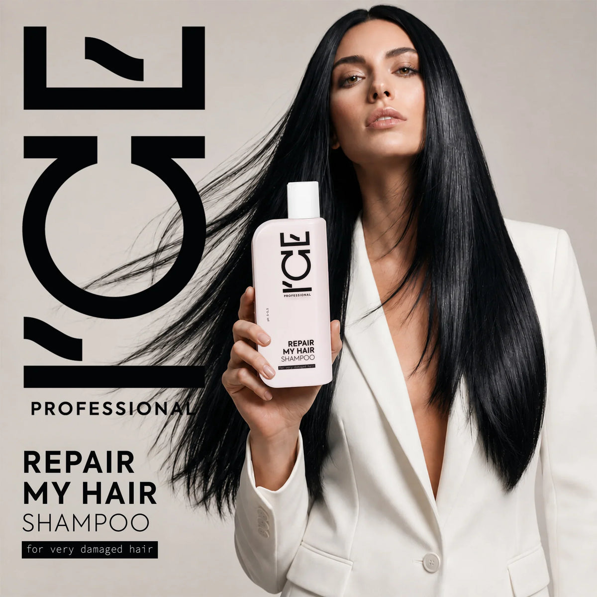 A woman in a white blazer holding a bottle of ICE Professional Repair My Hair Shampoo.