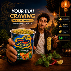 Person holding a Blue Dragon instant noodle cup with a scenic background