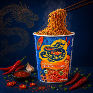 Blue Dragon Sriracha Chilli Sauce Instant Noodles with chopsticks lifting steaming noodles, red chilies, and garlic on dark blue background