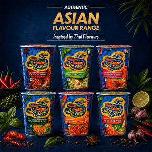 Assorted Blue Dragon instant noodle cups with Thai flavors on a dark blue background.