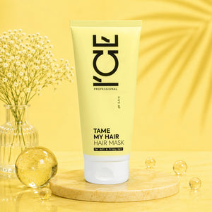 ICE Professional Tame My Hair Hair Mask tube on a marble pedestal with yellow background.
